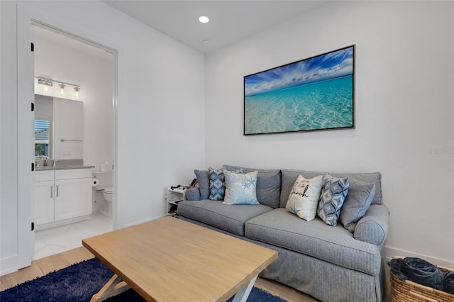 living room featuring recessed lighting and marble finish floor