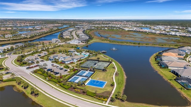 bird's eye view featuring a residential view and a water view