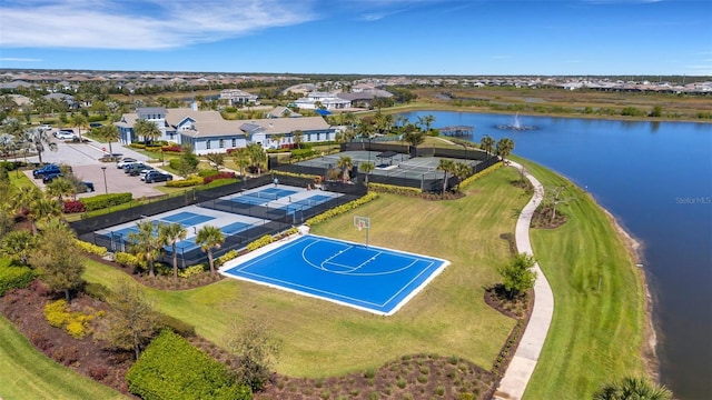 bird's eye view featuring a residential view and a water view