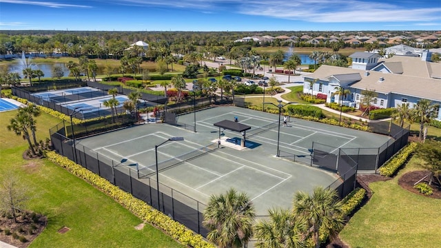 aerial view with a residential view and a water view