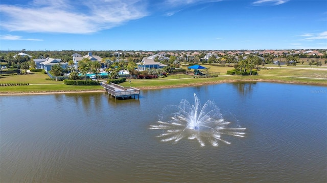 bird's eye view with a residential view and a water view