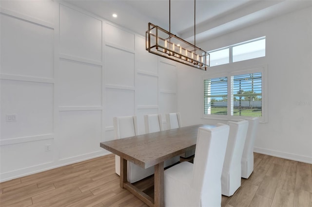 dining room featuring recessed lighting, baseboards, light wood finished floors, and a chandelier