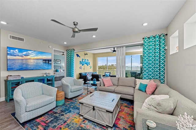 living area featuring visible vents, recessed lighting, ceiling fan, and wood finished floors