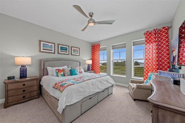 bedroom featuring baseboards, carpet floors, and ceiling fan