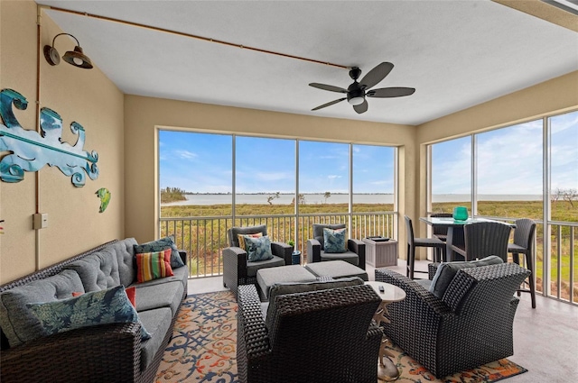 sunroom / solarium featuring ceiling fan