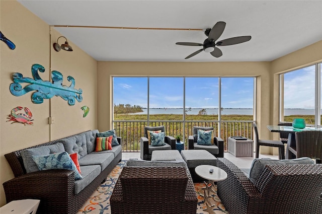 sunroom with a wealth of natural light and ceiling fan