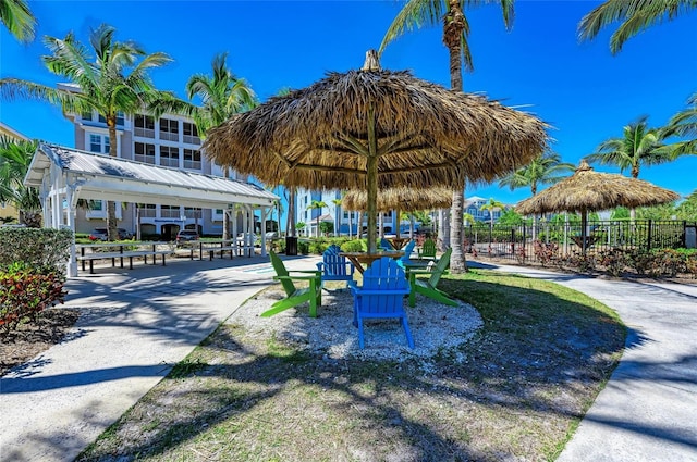 view of home's community with a gazebo and fence