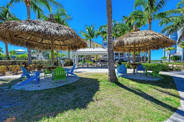 view of property's community with a gazebo and a yard