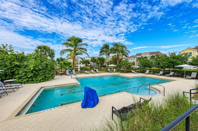 community pool with a patio