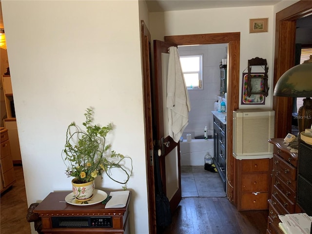 corridor with dark wood-style flooring