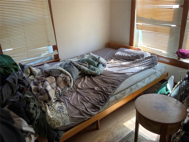 bedroom with wood finished floors