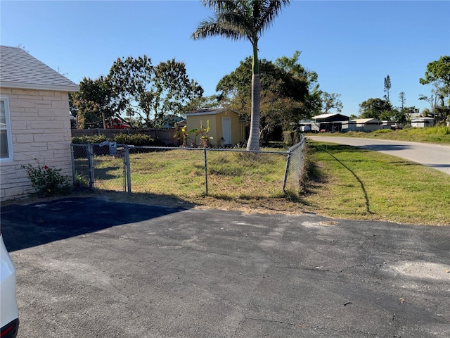 view of yard featuring a gate and fence