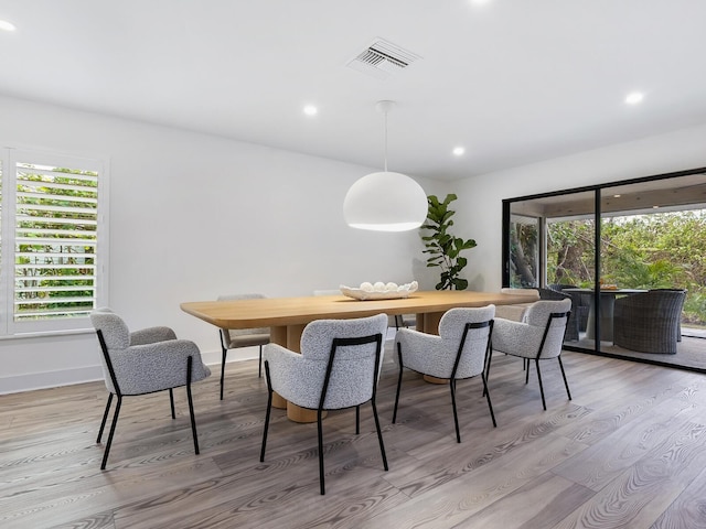 dining room featuring visible vents, recessed lighting, light wood-type flooring, and baseboards