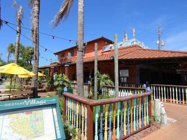 view of home's community with fence