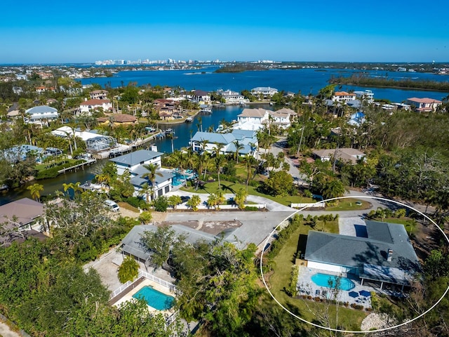 birds eye view of property with a residential view and a water view