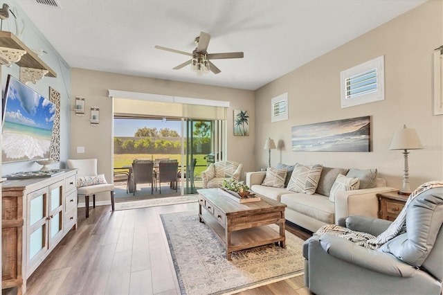 living room featuring wood finished floors and ceiling fan