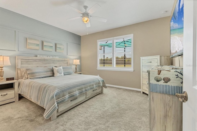 carpeted bedroom featuring baseboards and ceiling fan