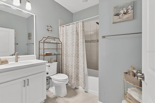 full bath with tile patterned floors, shower / bath combination with curtain, toilet, and vanity