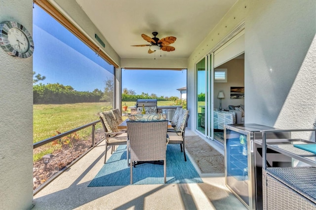 view of patio / terrace with outdoor dining space, a ceiling fan, and a grill