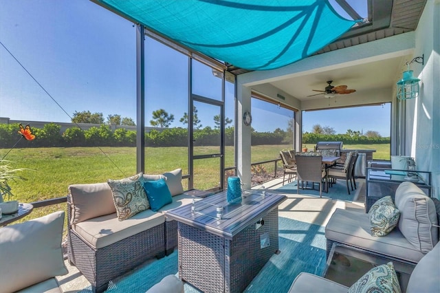 view of patio with a lanai, outdoor dining space, an outdoor living space, and a ceiling fan