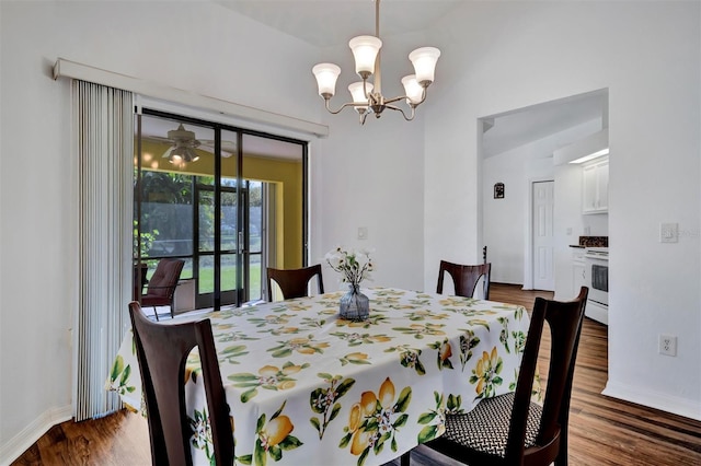 dining room featuring a notable chandelier, baseboards, and dark wood-style flooring