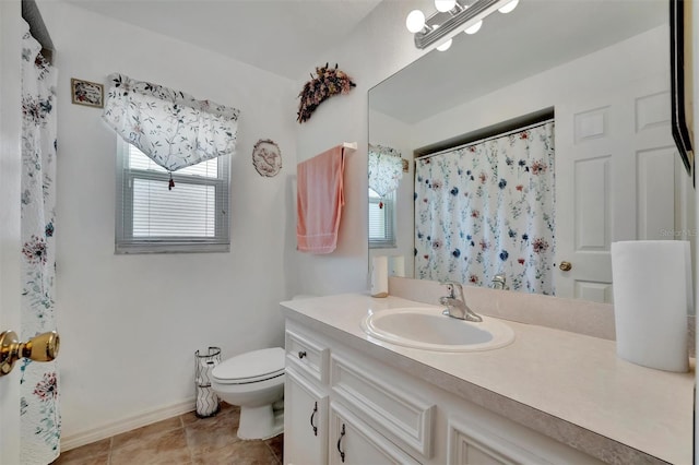 bathroom with baseboards, toilet, a shower with shower curtain, tile patterned floors, and vanity