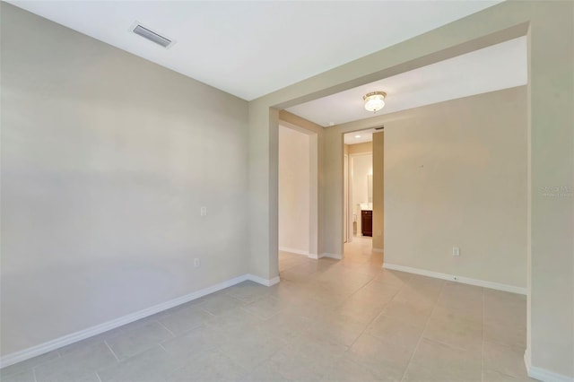 324 Casalino Dr, Nokomis, FL 34275 - spare room featuring light tile patterned floors, visible vents, and baseboards