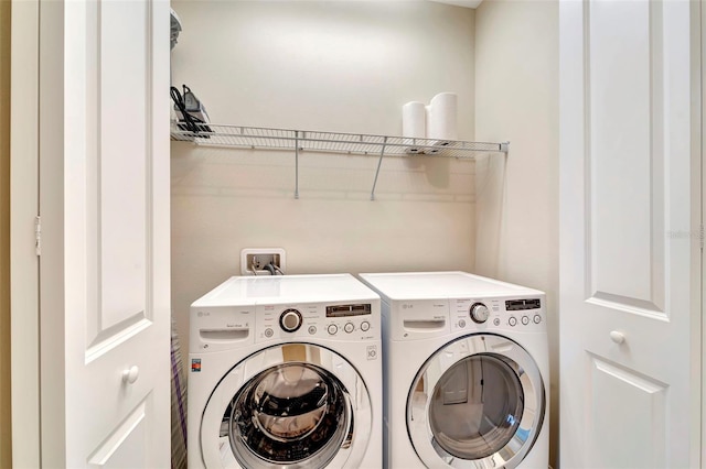 324 Casalino Dr, Nokomis, FL 34275 - clothes washing area featuring washing machine and dryer and laundry area