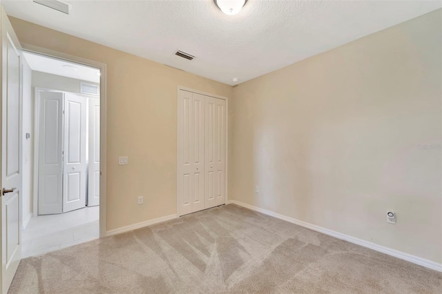 324 Casalino Dr, Nokomis, FL 34275 - unfurnished bedroom featuring carpet flooring, visible vents, a closet, and baseboards