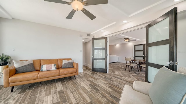 living area featuring visible vents, wood finished floors, recessed lighting, baseboards, and ceiling fan