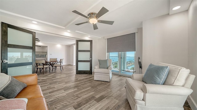 living area featuring recessed lighting, wood finished floors, and a ceiling fan