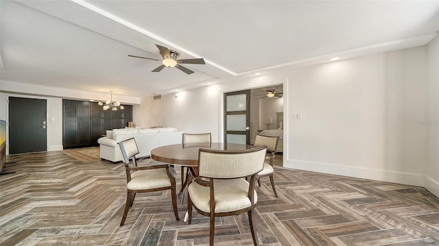 dining room featuring recessed lighting, ceiling fan with notable chandelier, and baseboards