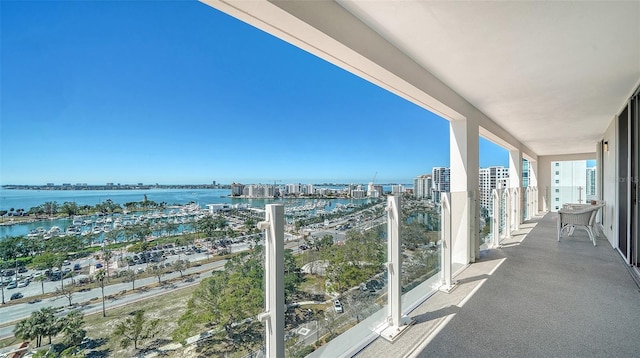 balcony with a view of city and a water view