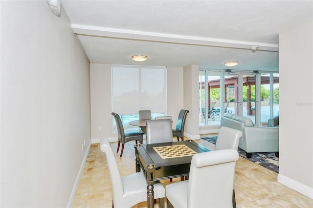 dining room featuring baseboards