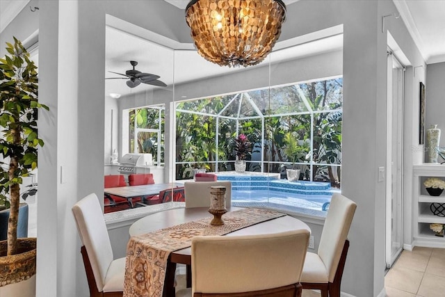 interior space featuring a wealth of natural light, ceiling fan with notable chandelier, and a sunroom