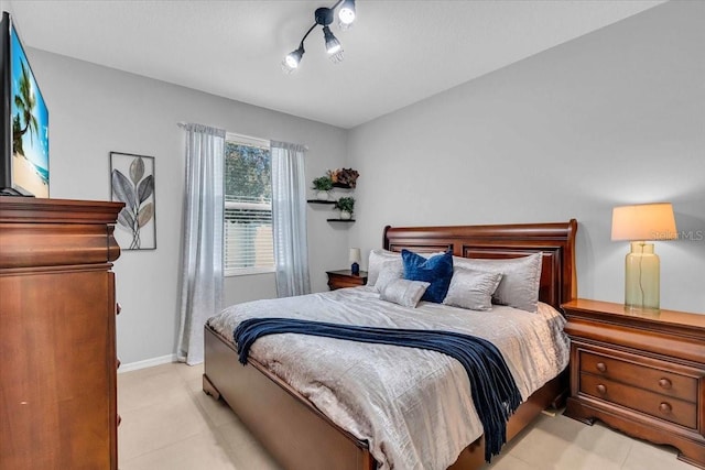 bedroom featuring baseboards