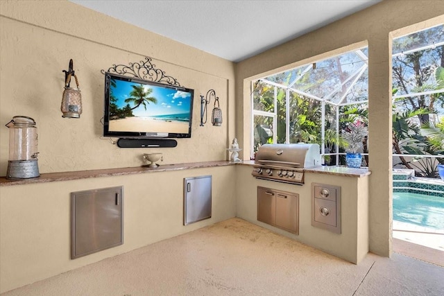 view of patio / terrace with a lanai, an outdoor pool, a grill, and exterior kitchen