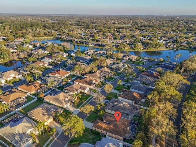 bird's eye view featuring a residential view and a water view