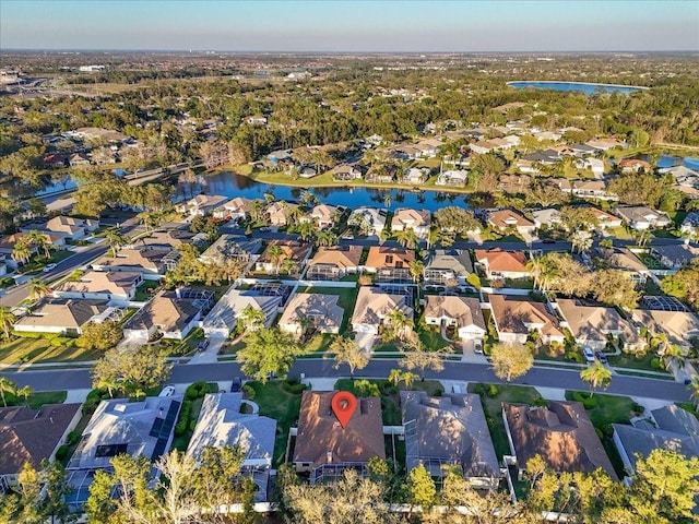 bird's eye view featuring a residential view and a water view