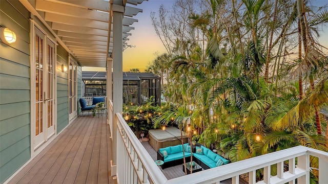 view of balcony at dusk