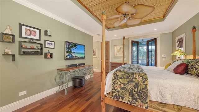 bedroom featuring access to exterior, crown molding, a raised ceiling, and baseboards