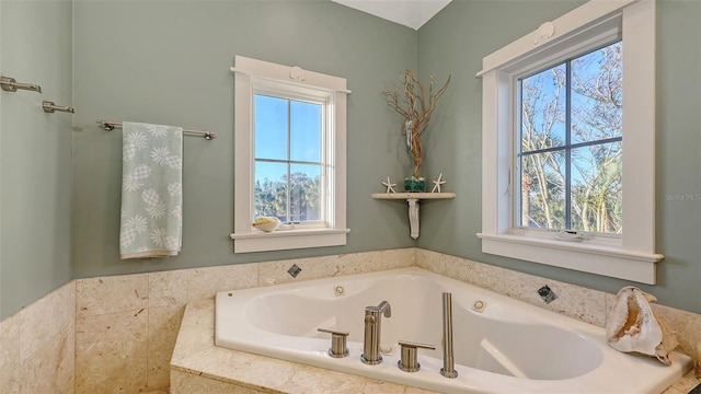 full bath with a garden tub and a wealth of natural light