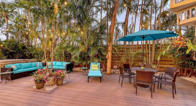 wooden deck featuring an outdoor living space and outdoor dining area