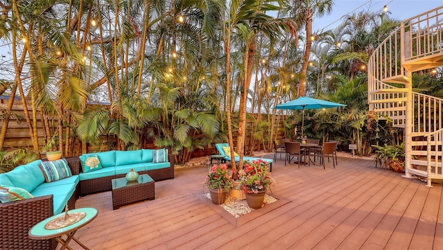 deck featuring outdoor dining space and an outdoor hangout area