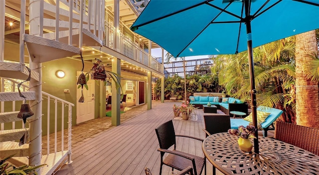 wooden deck featuring outdoor dining space and outdoor lounge area