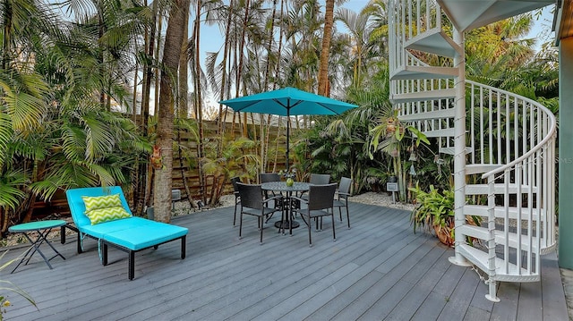 wooden deck featuring outdoor dining space