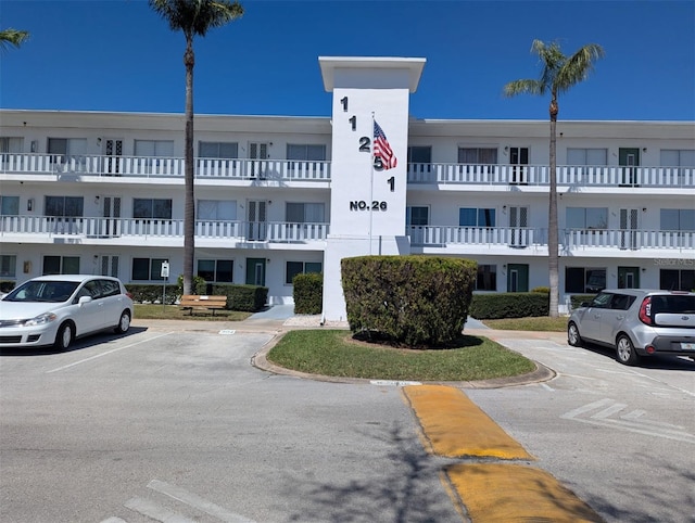 view of property featuring uncovered parking