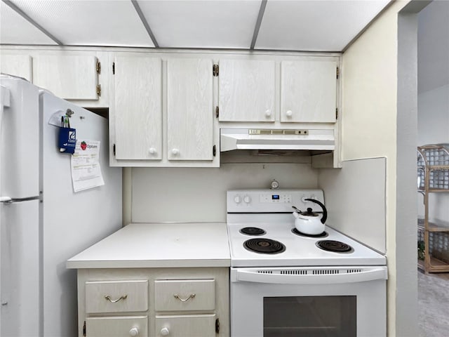 kitchen featuring under cabinet range hood, white appliances, and light countertops