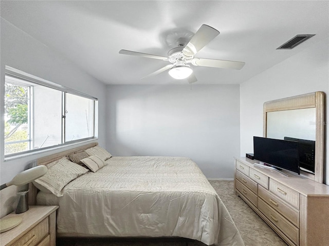 bedroom with visible vents and a ceiling fan