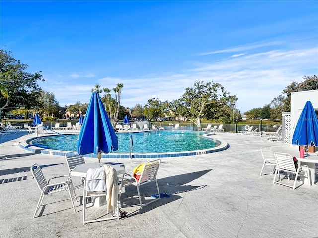 pool featuring a patio and fence